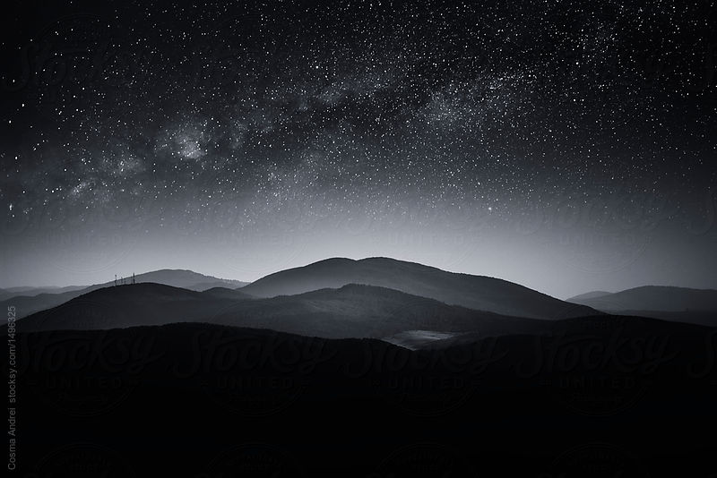 Starry night mountain landscape with Milky Way
