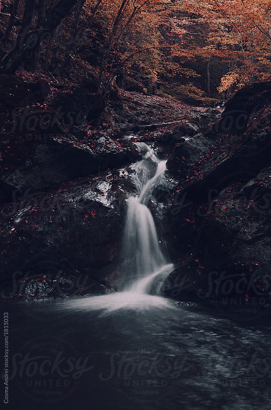 Surreal mountain river waterfall in autumn forest