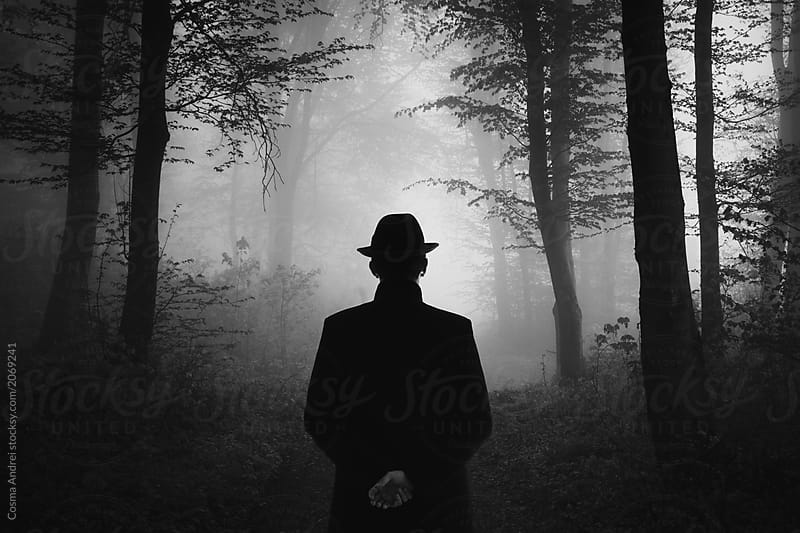 timeless_man_silhouette_in_mysterious_dark_forest